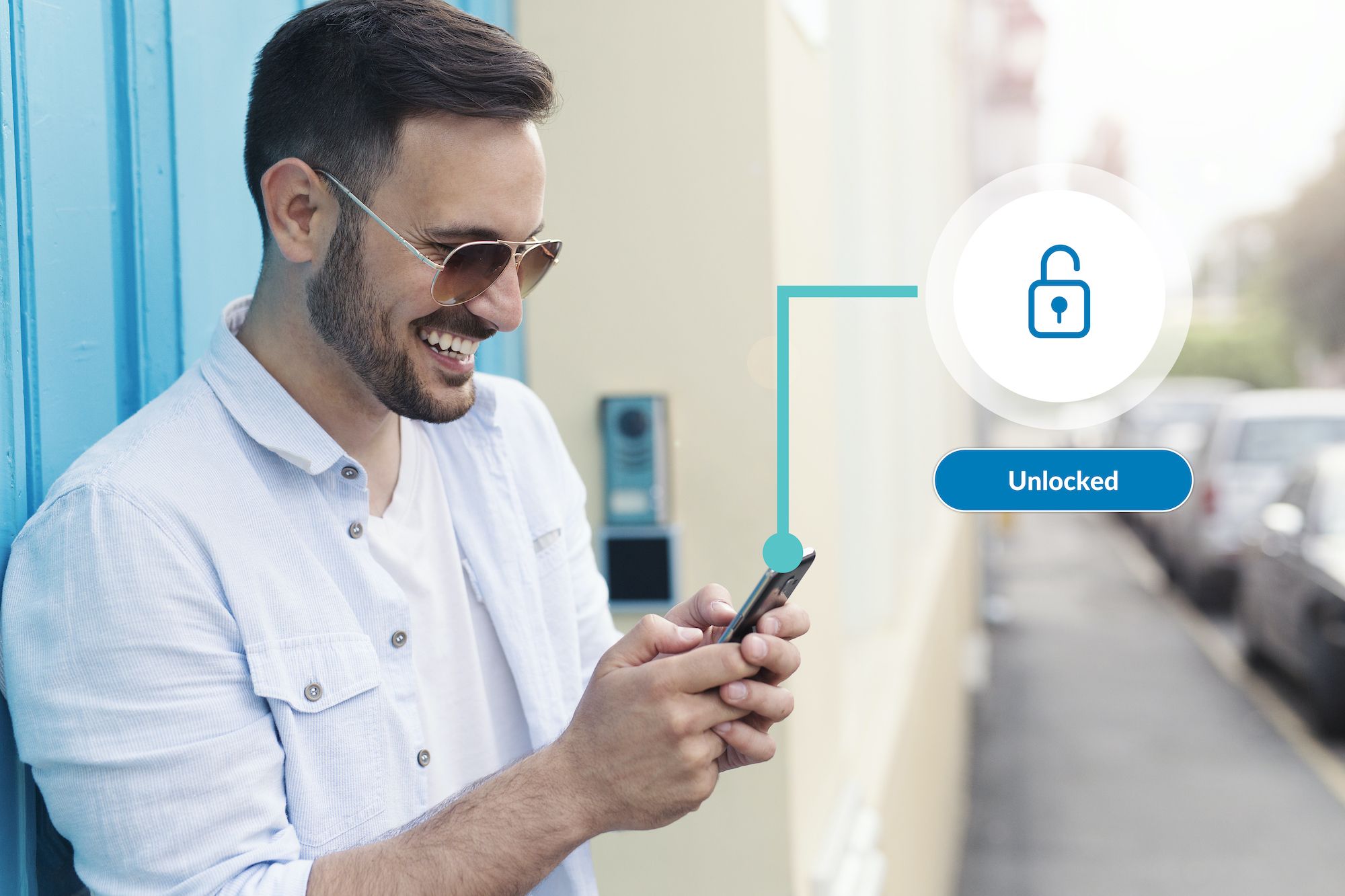 Smiling man using phone to unlock door with smart home technology