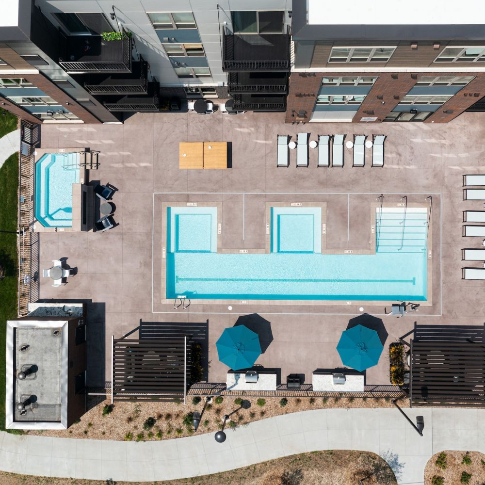 Aster Helios Lounge with E-Shaped Outdoor Pool, Spa, and Grills